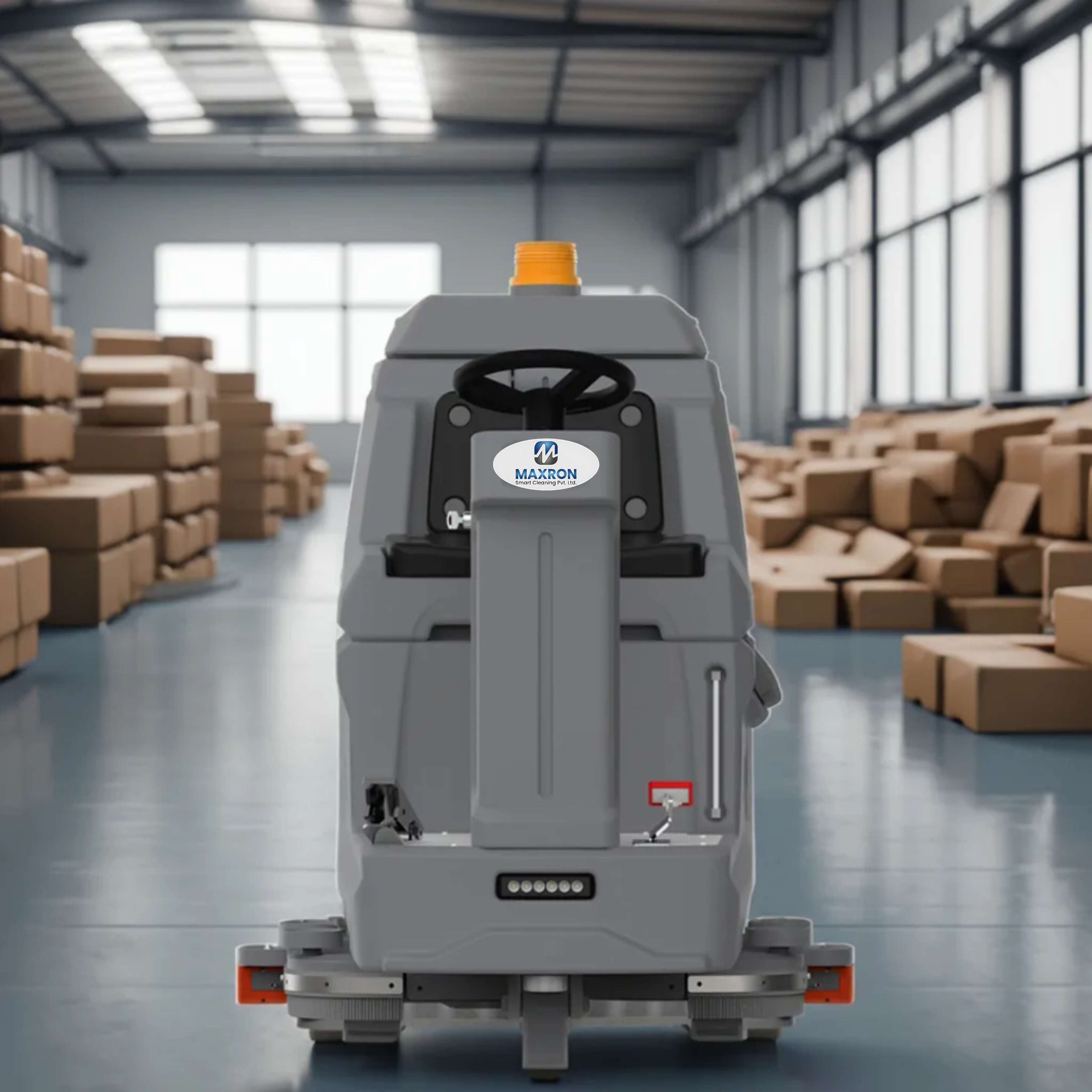 Maxron ride-on floor sweeper in industrial warehouse showroom Delhi NCR